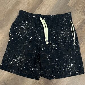Fabletics linerless The One short in black with speckled sunburst yellow